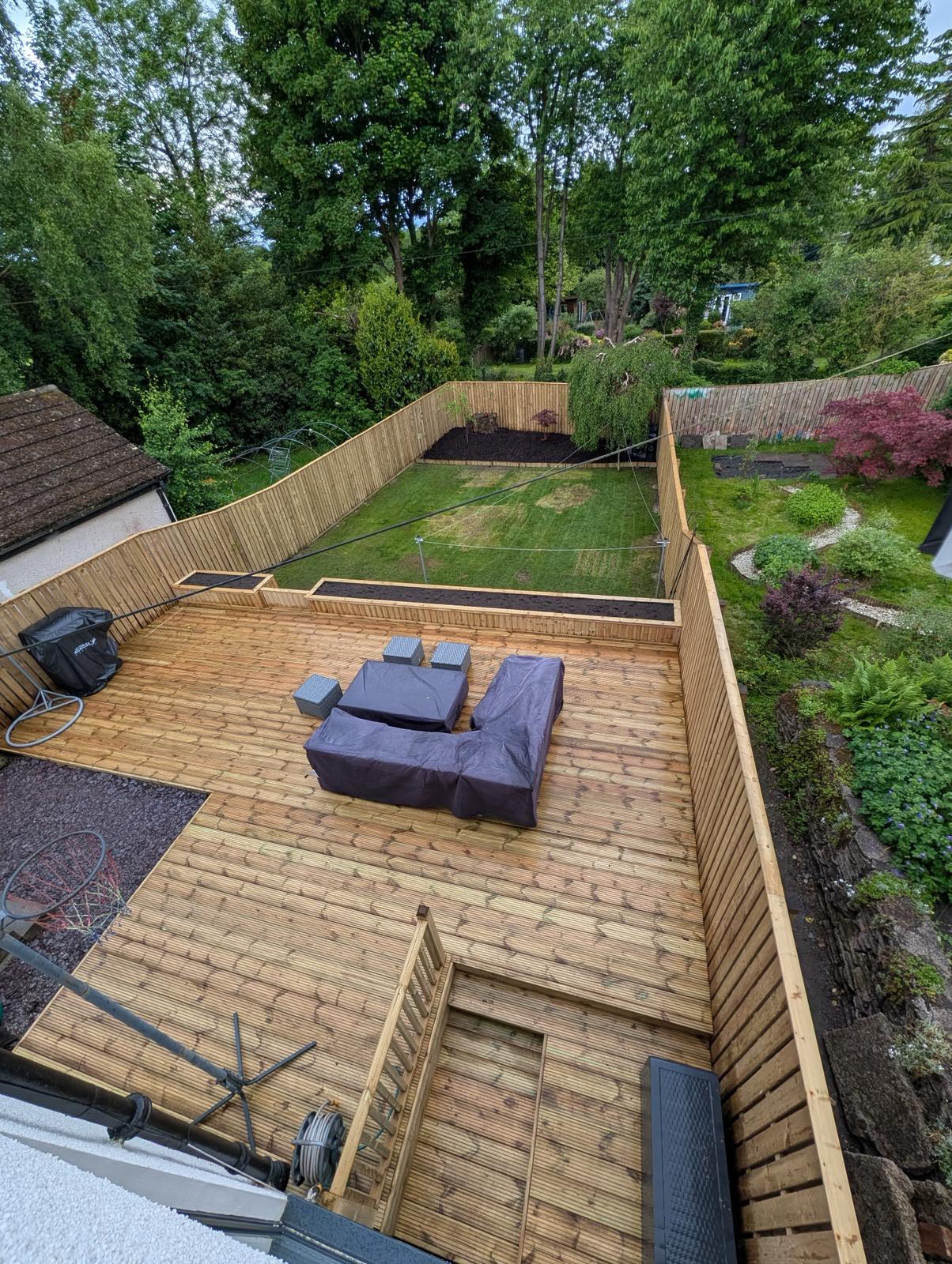 Aerial view of timber decking area with garden fencing
