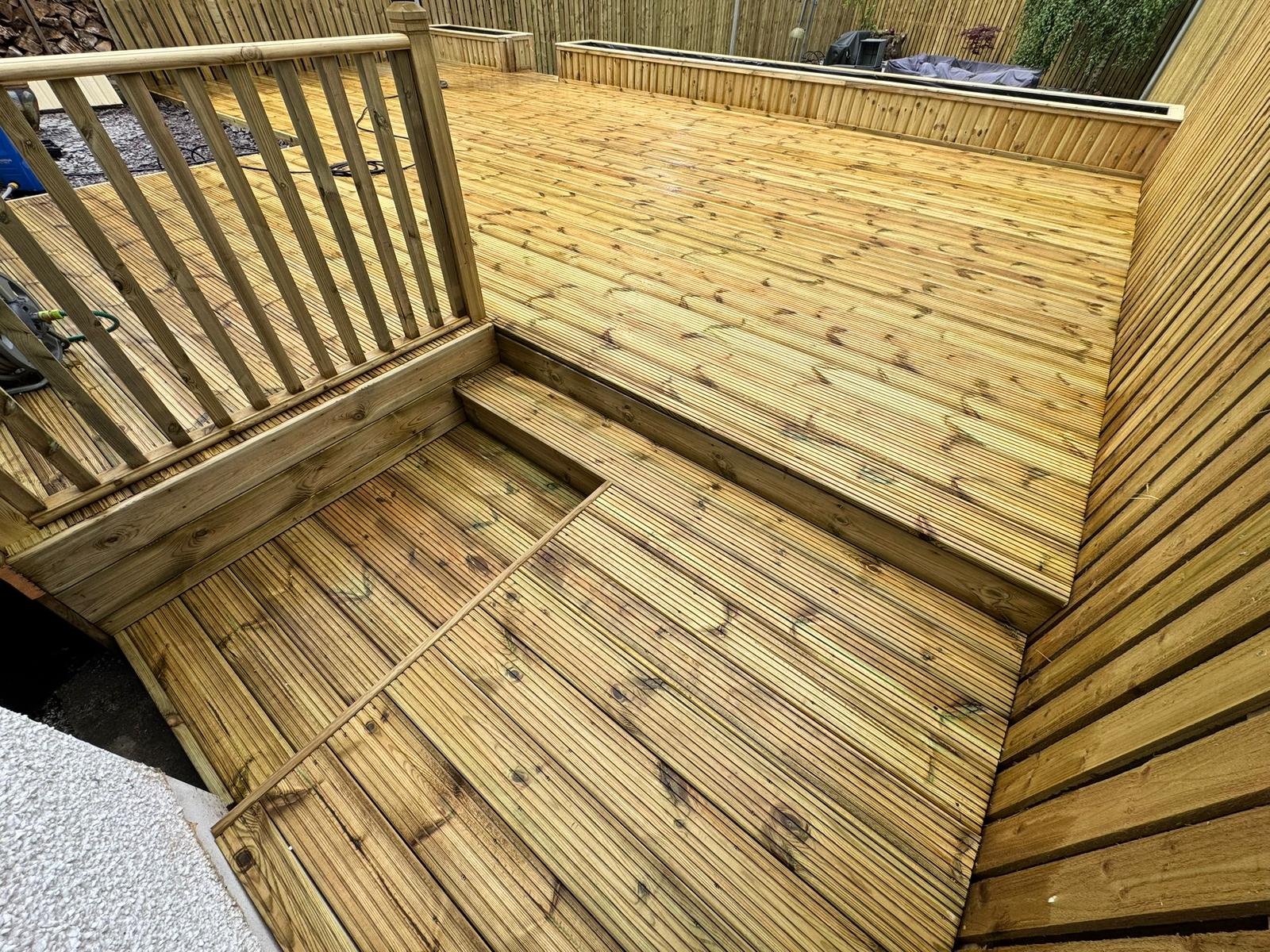 Multi-level timber decking with integrated steps and balustrade