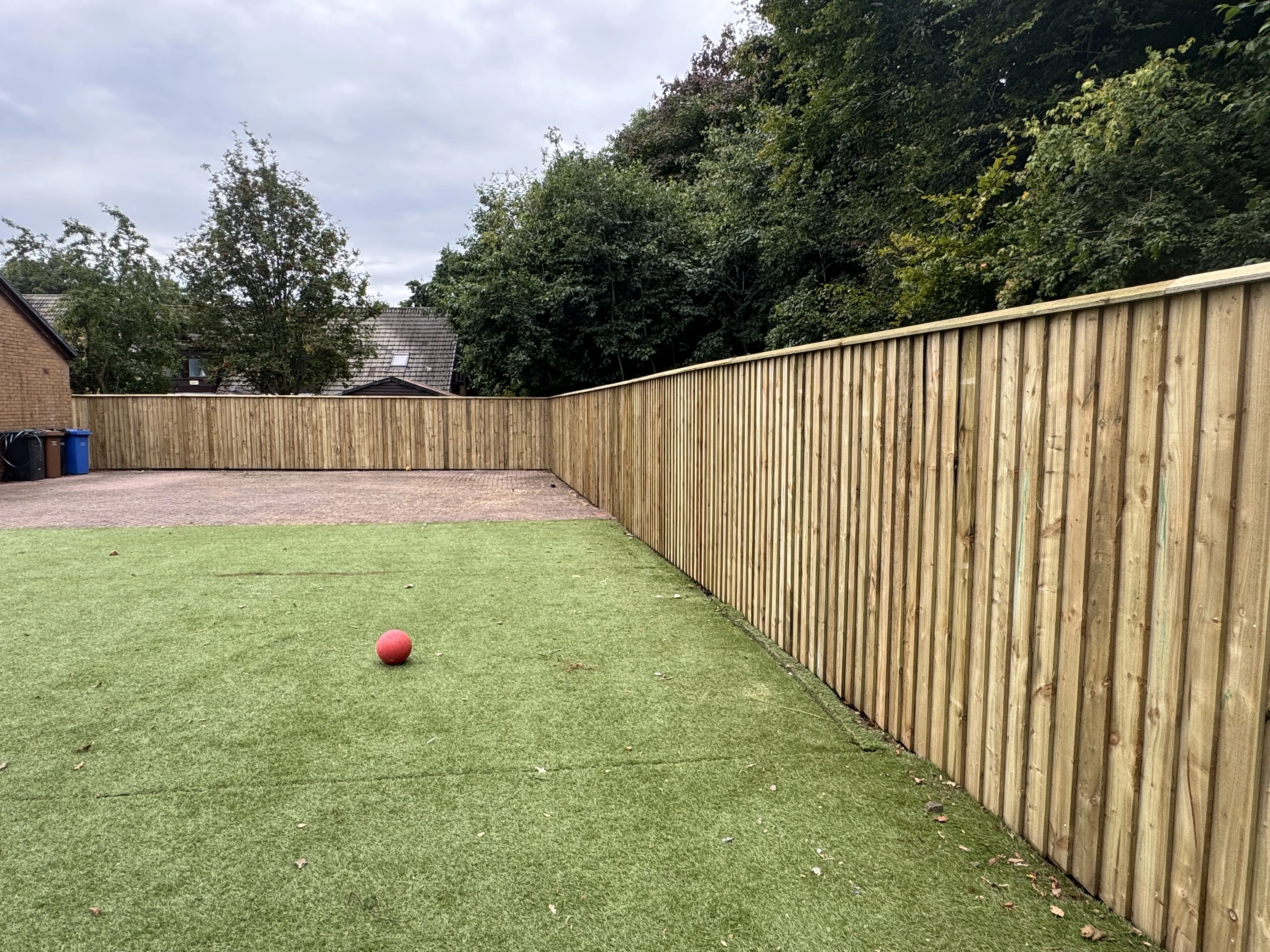 Timber overlap fencing with coping and double gates in Irvine, Ayrshire